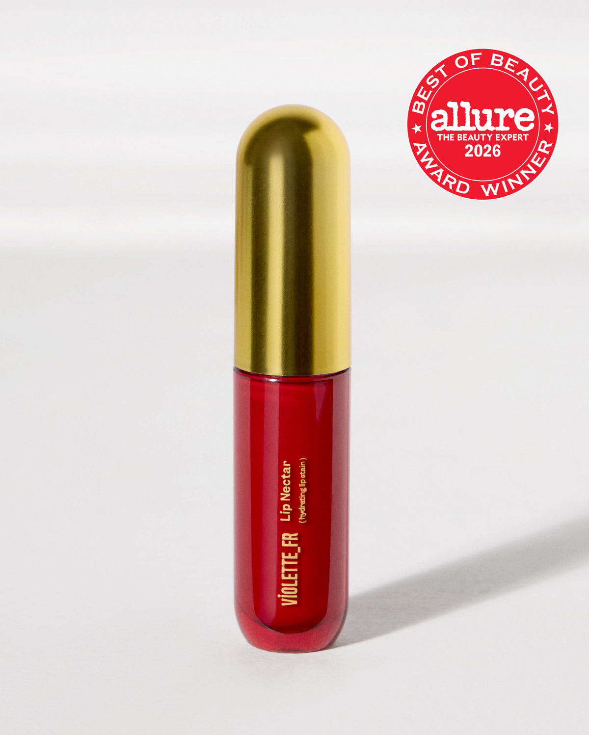 VIOLETTE_FR Lip Nectar (hydrating lip stain) in a red bottle with a gold cap, featuring an Allure Best of Beauty Award Winner 2026 seal.