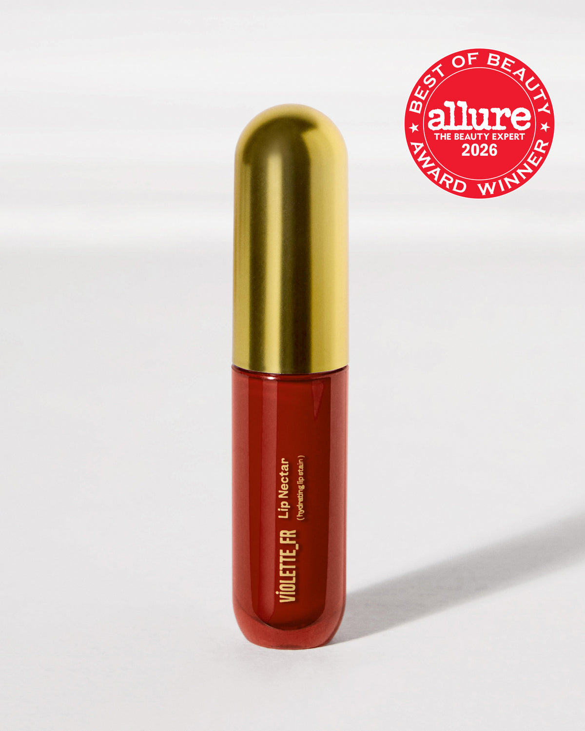 Lip Nectar - Bêtise - VIOLETTE_FR Lip Nectar (hydrating lip stain) in a deep red bottle with a gold cap, awarded 'BEST OF BEAUTY allure THE BEAUTY EXPERT 2026 AWARD WINNER'. - Image 39 of 39