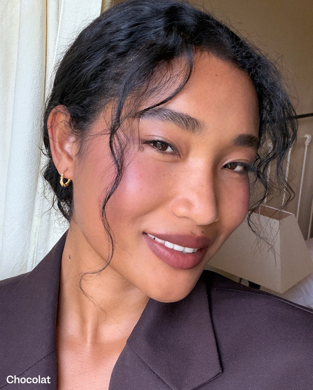 Bisou Balm - Calisson - Chocolat. Close-up of a woman with medium skin tone wearing cool brown lipstick with pink and red undertone from her natural lip color. - Image 26 of 26